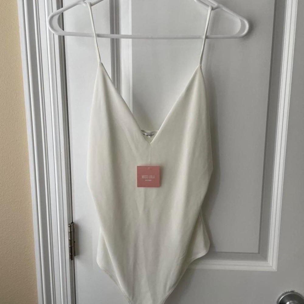 Miss Lola v-neck body suit. Never worn.